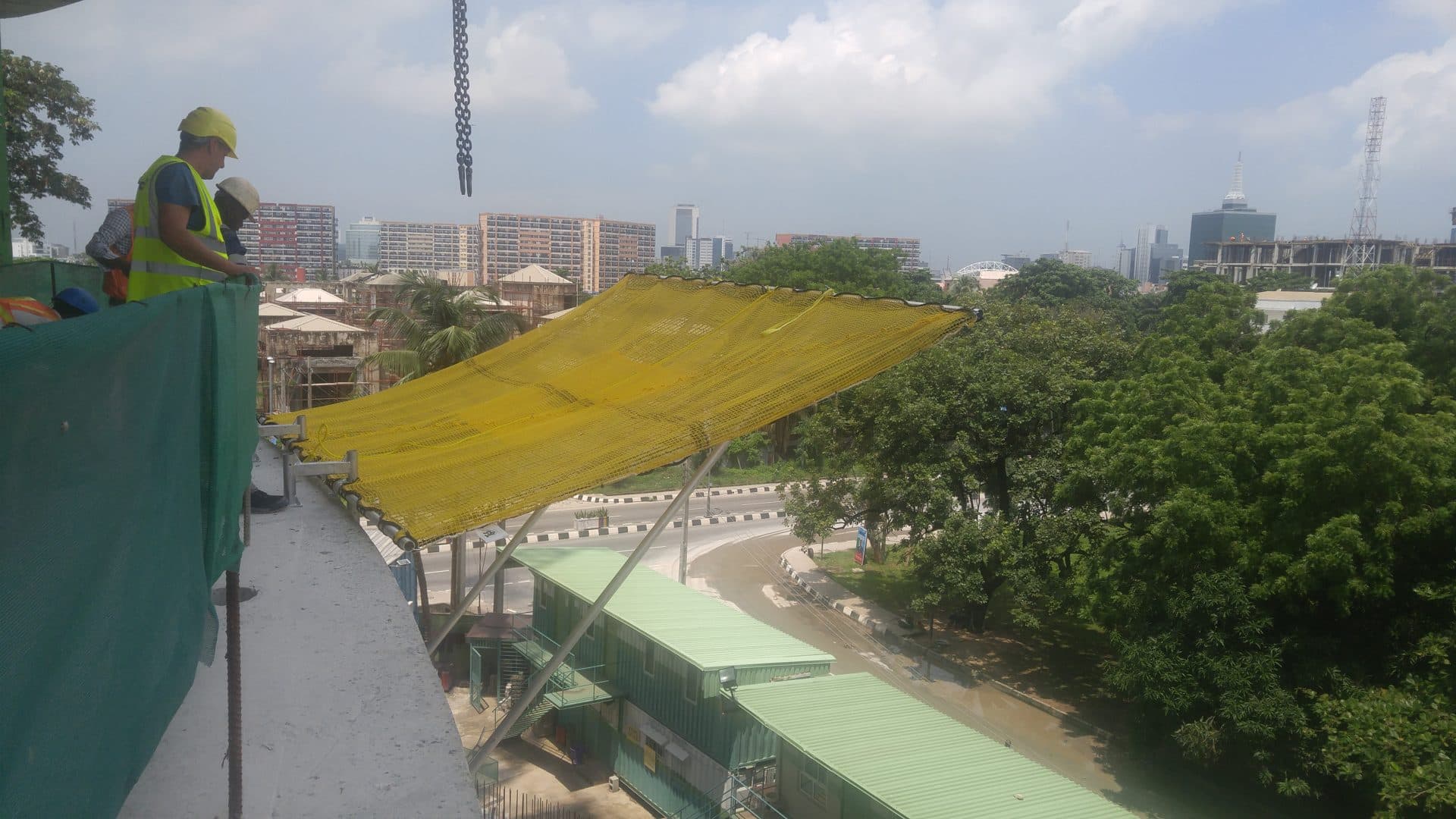 Fall arrest net installed at the working level